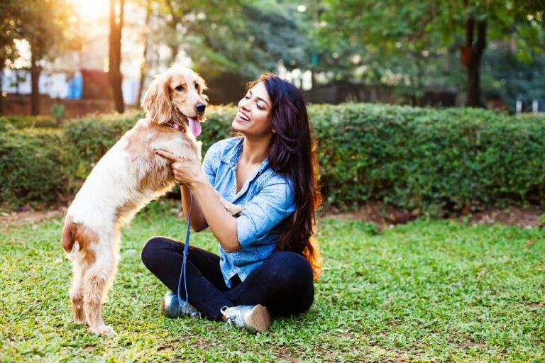Happy dog and owner at park