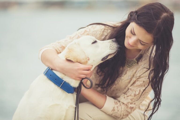 woman hugging dog