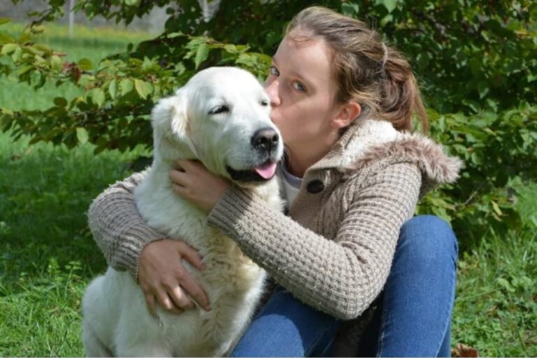 Woman hugging Golden Retriever