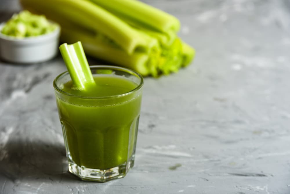 Small glass of celery juice on a table