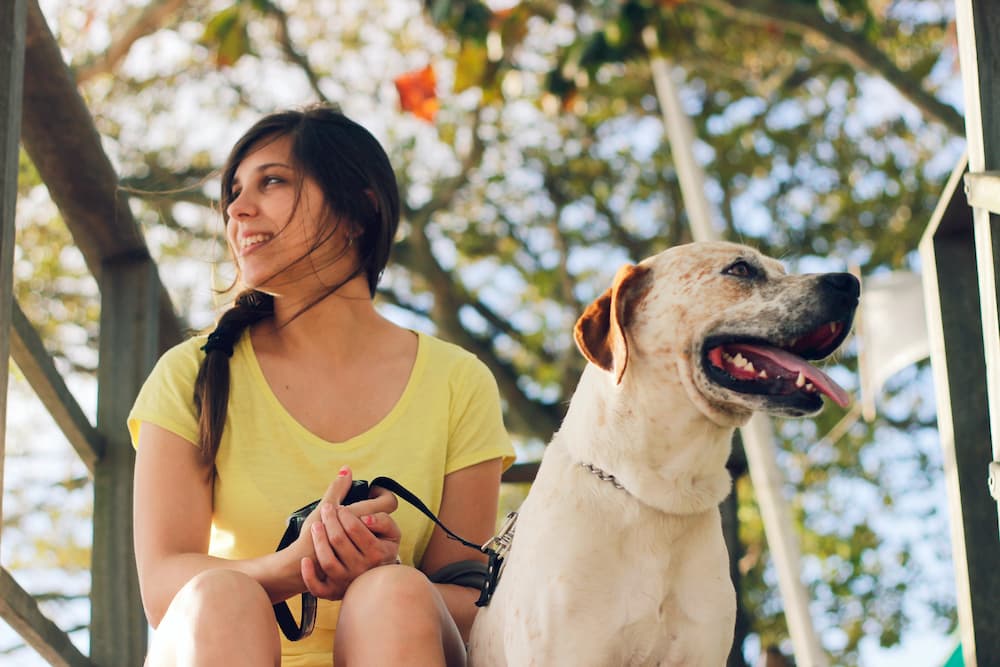 Woman and her dog in the woods