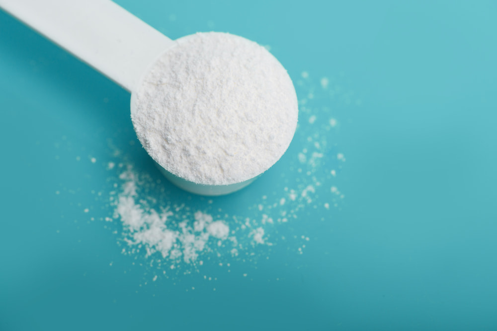 MSM powder on blue background